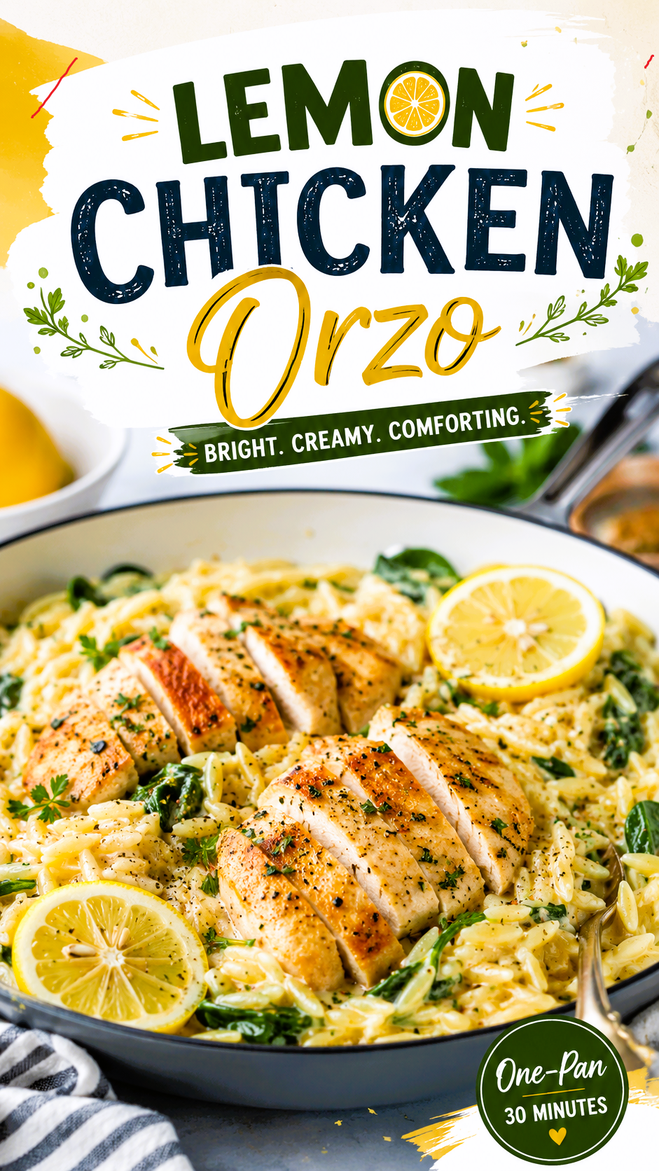 Creamy Lemon Chicken Orzo served in a skillet with sliced grilled chicken breast, fresh lemon slices, spinach, and Parmesan cheese, topped with a bold Lemon Chicken Orzo recipe title.